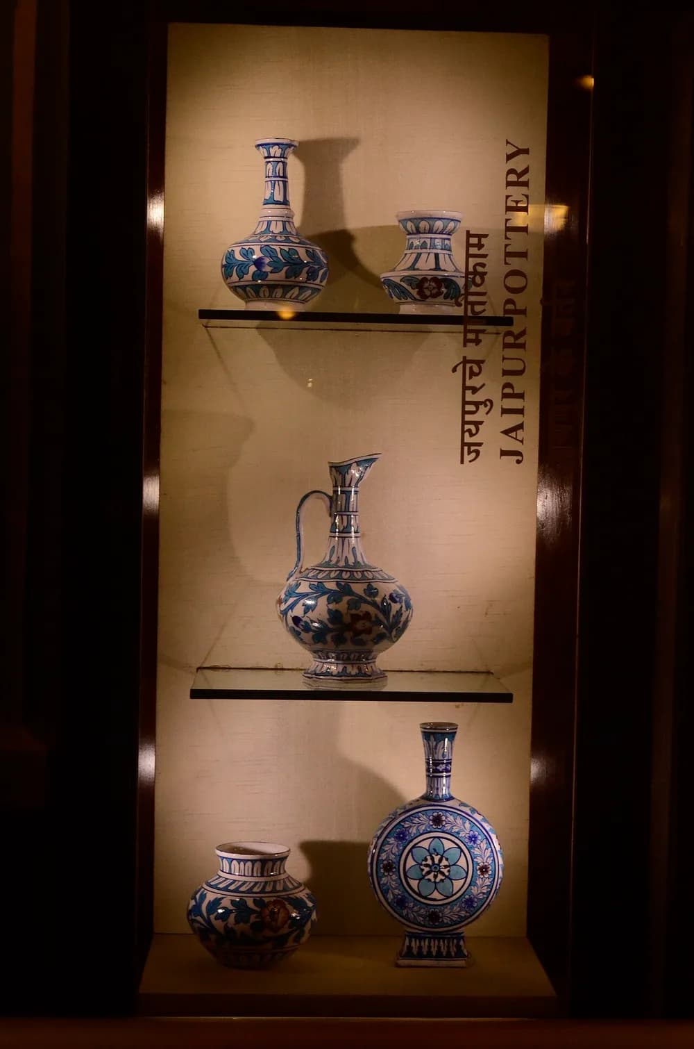 Decorated pottery objects displayed in a museum